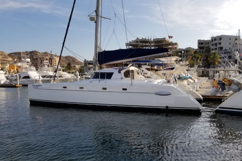43-foot Belize sailing catamaran moored in a marina