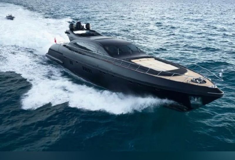 Matte black 108-foot Mangusta superyacht cruising at speed